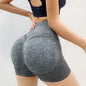 Seamless high waisted scrunch butt workout shorts providing sculpting and supportive fit during exercise