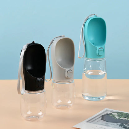 Portable leak-proof dog water bottle with built-in drinking cup used during outdoor walk